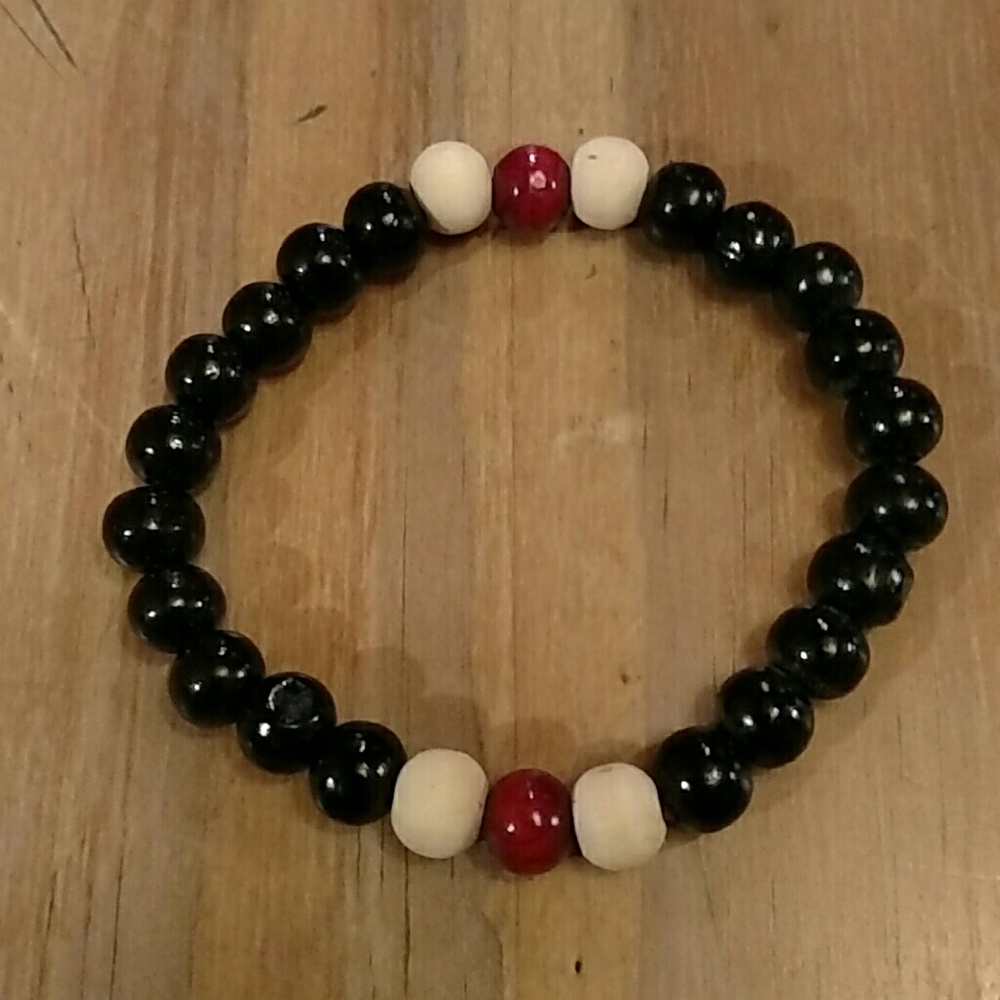 EUC black, red, and cream beaded bracelet.
